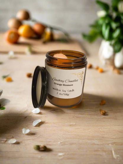 Wickless orange blossom candle neutral in color with a peg of orange 